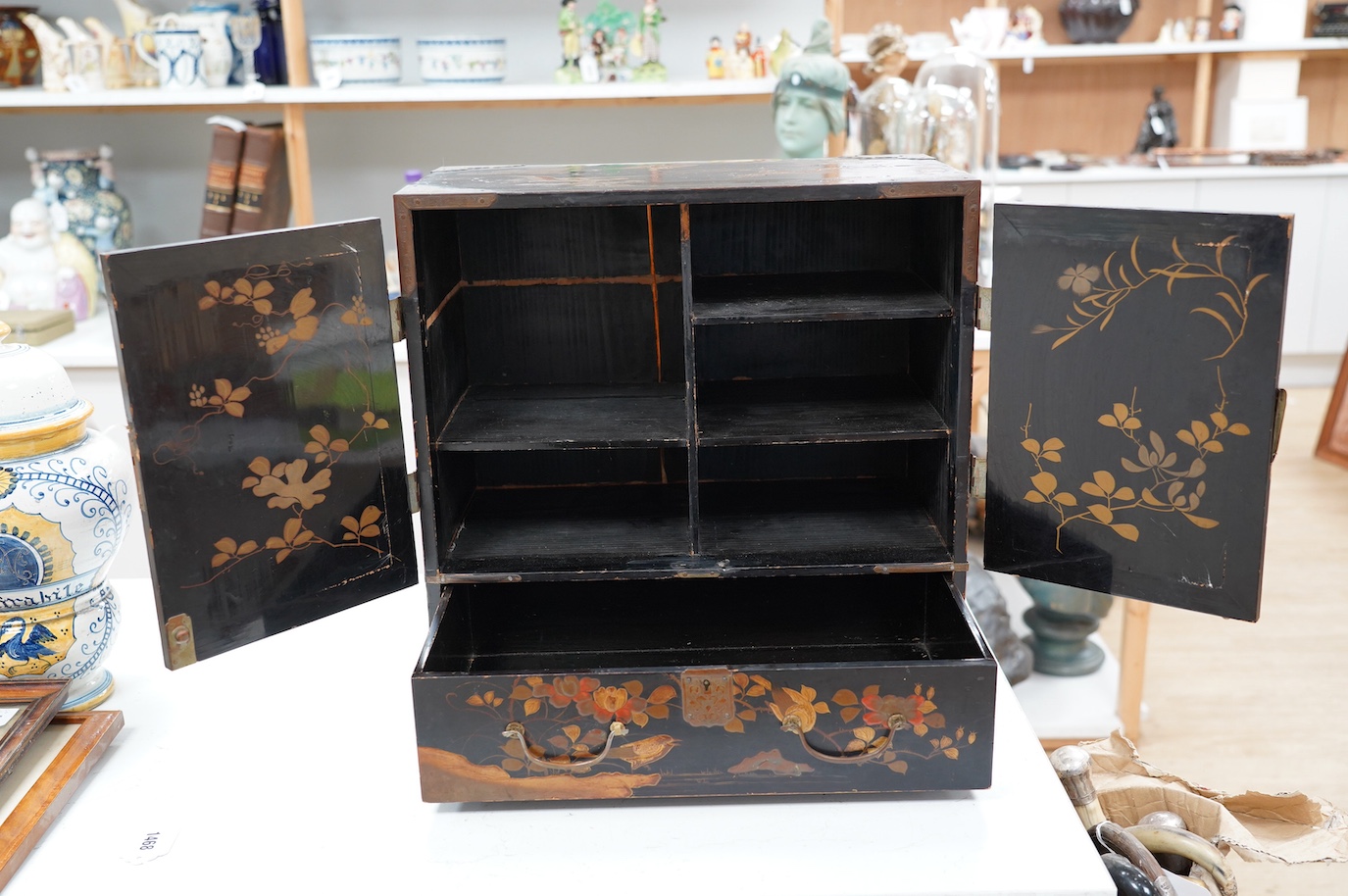 A 19th century Japanese lacquered table cabinet, 46cm. Condition - poor